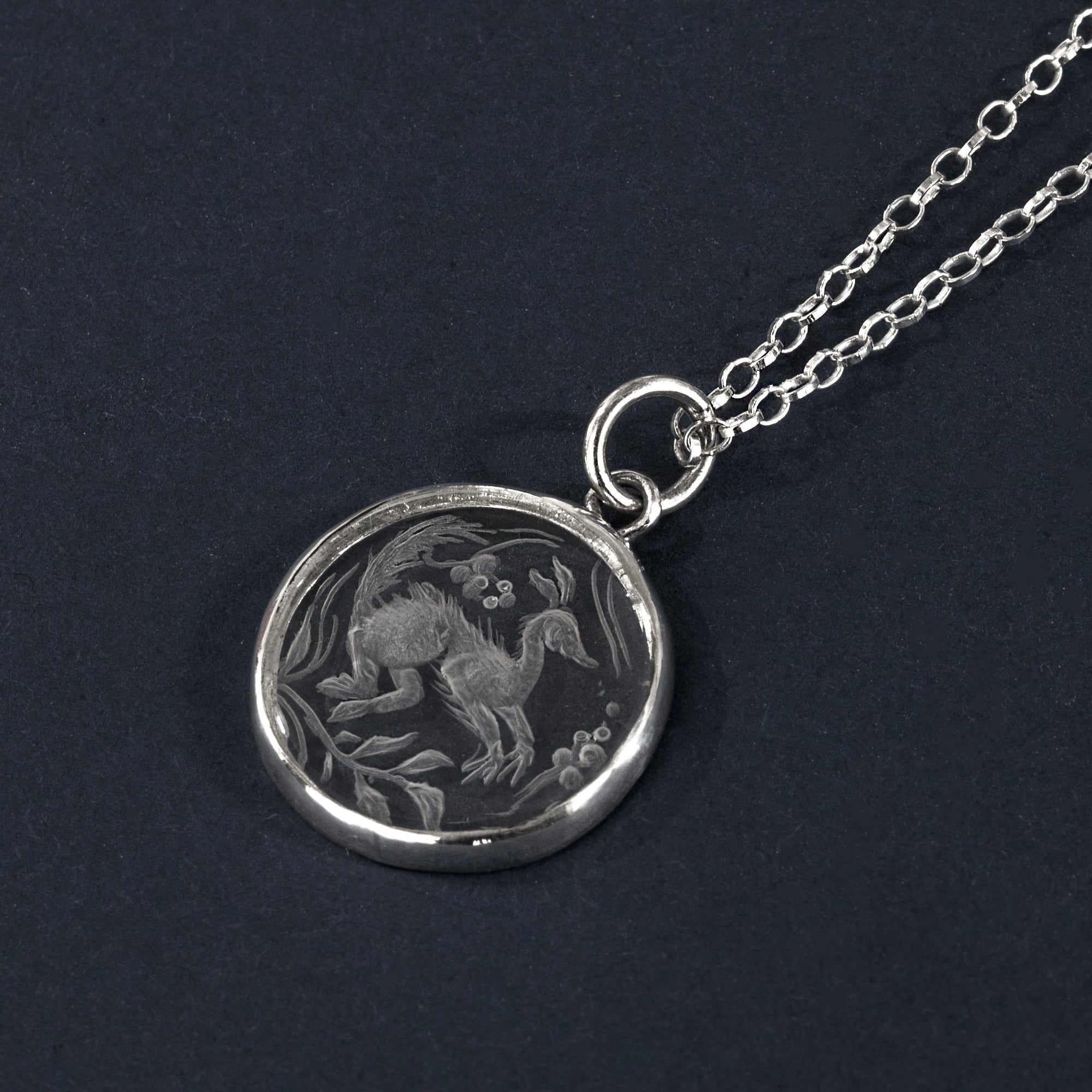 Long-tailed beastie rock crystal intaglio necklace