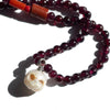 Garnet + pearl carved skull necklace