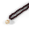 Garnet + pearl carved skull necklace