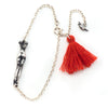 Headless woman + cardinal bracelet