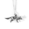 Side view of handmade silver fox pendant showing profile and tail