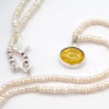 Amber fish intaglio and and pearl necklace