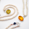 Amber toy tiger intaglio and and pearl necklace