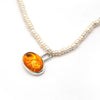 Amber toy tiger intaglio and and pearl necklace