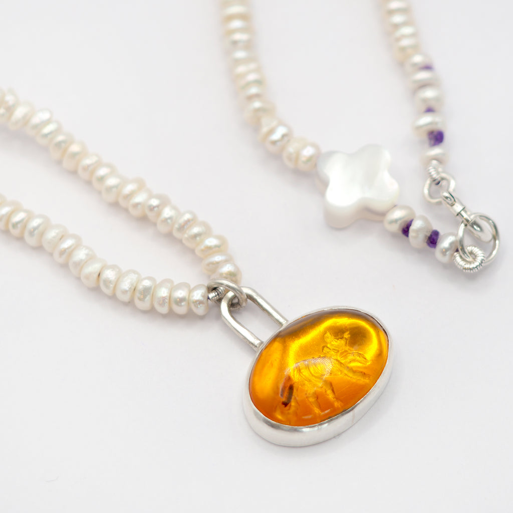 Amber toy tiger intaglio and and pearl necklace