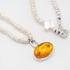 Amber toy tiger intaglio and and pearl necklace