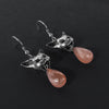 Peach moonstone cat vomit drop-earrings