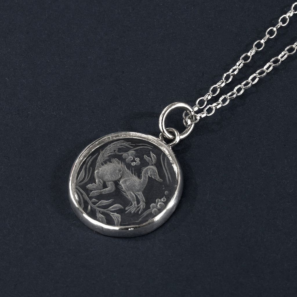 Long-tailed beastie rock crystal intaglio necklace