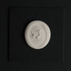 Turquoise intaglio dog necklace: an impression taken from the carving, the dog standing out in white relief where the stone is cut away, a working reference rather than the piece