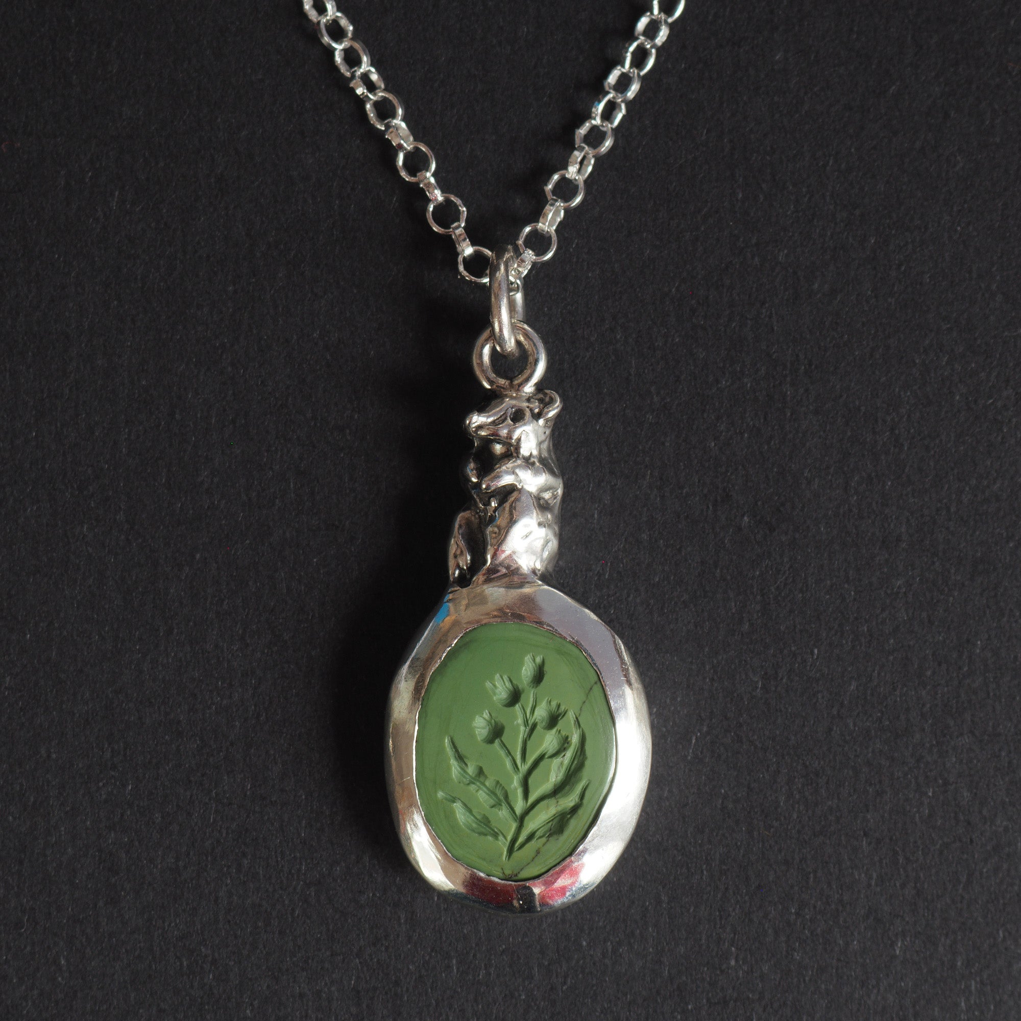 Field mouse intaglio necklace - a mouse necklace, a small silver mouse sculpted in the setting and perched above an olive-green turquoise carved with wild foliage