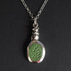 Field mouse intaglio necklace - a mouse necklace, a small silver mouse sculpted in the setting and perched above an olive-green turquoise carved with wild foliage