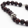 Knotted snake and garnet bracelet