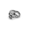 Side view of the handcrafted sterling silver skull ring showing the organic molten band design.