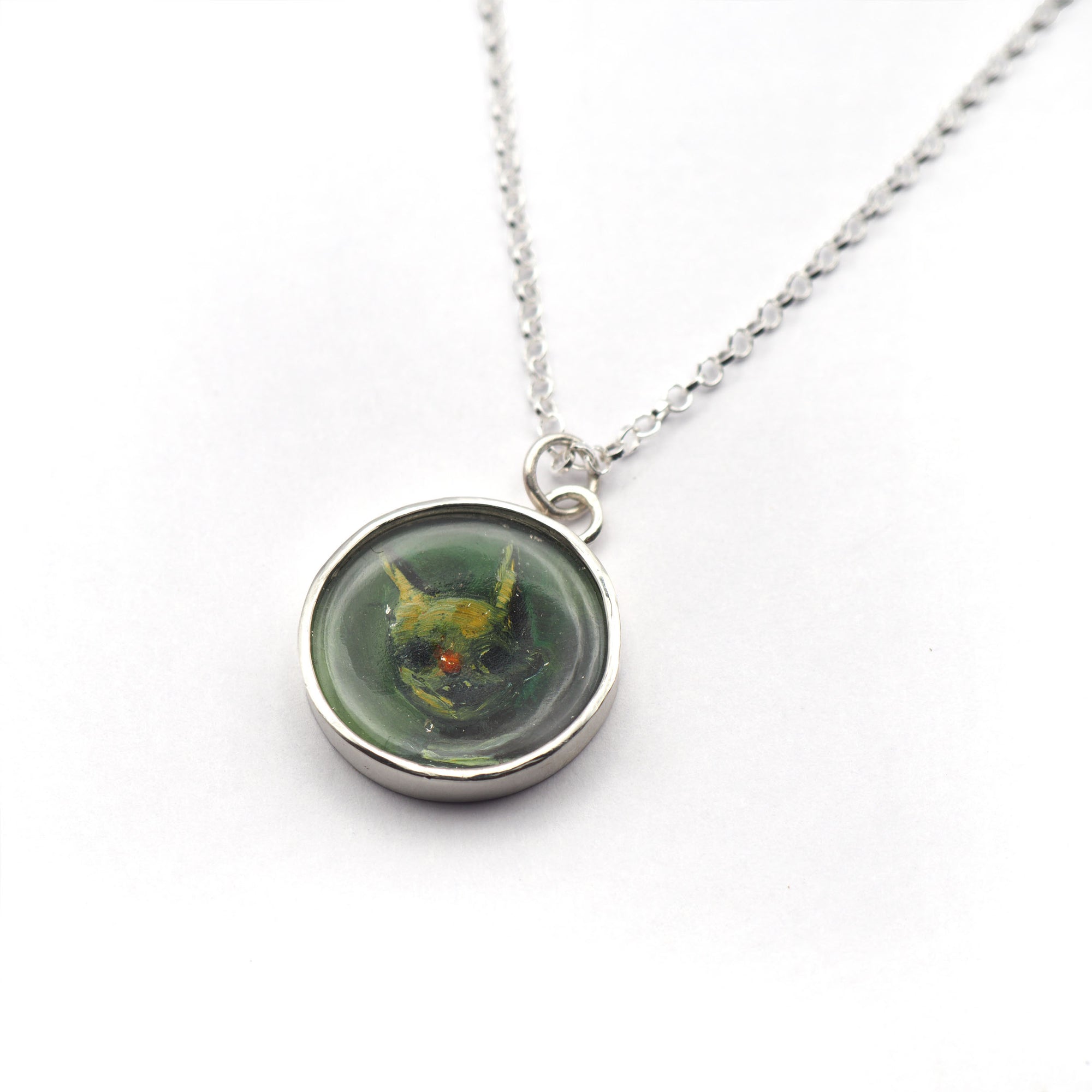 Red-nosed boy oil painting pendant