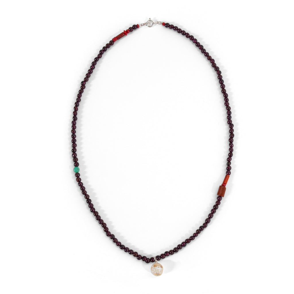 Garnet + pearl carved skull necklace
