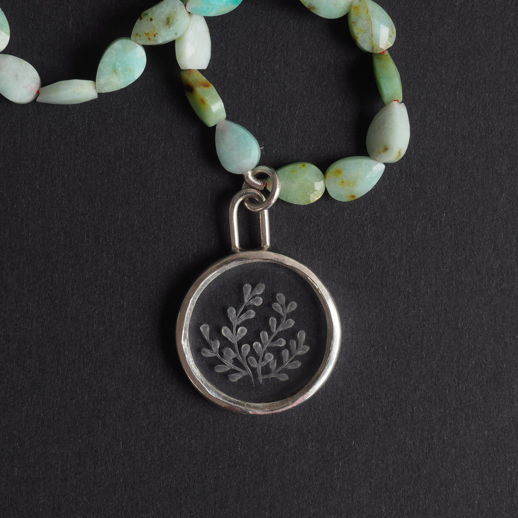 quartz and chrysoprase seaweed intaglio necklace - a seaweed necklace, fronds of seaweed reverse-carved into a clear rock crystal disc, strung on faceted chrysoprase beads