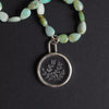 quartz and chrysoprase seaweed intaglio necklace - a seaweed necklace, fronds of seaweed reverse-carved into a clear rock crystal disc, strung on faceted chrysoprase beads