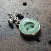 Hollow-eyed skull turquoise intaglio charm