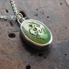 Turquoise skeleton intaglio necklace