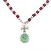 Hollow-eyed skull turquoise intaglio charm