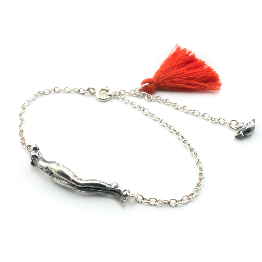 Headless woman + cardinal bracelet