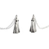Two silver ghost necklaces shown side by side, handcrafted in sterling silver with oxidised eyes and high-shine finish.